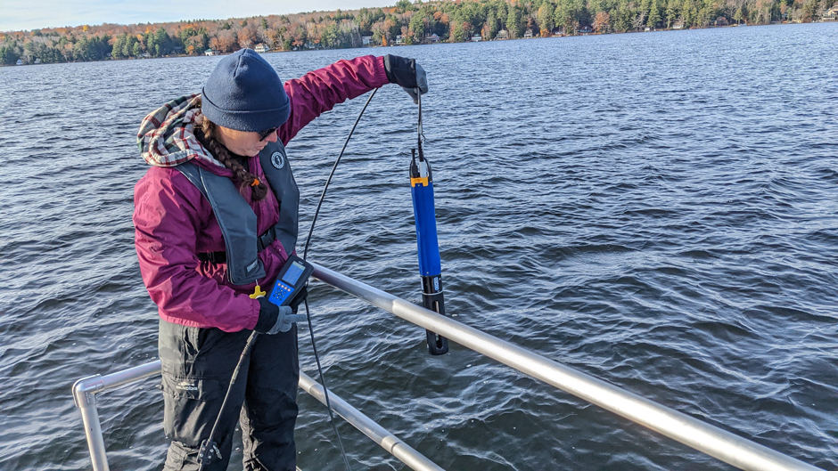 LEA Staff Limnologist Maggie Welch starting a profile using a YSI EXO2 sonde on Long Lake, Harrison, Maine