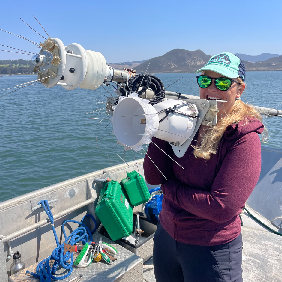 Diving technician Kaitlin Johnson holds the top-side pole at BS1 for repairs to the Gill weather station.