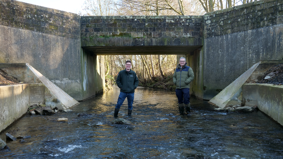 Dr Ryan Taylor (left) and Dr Tim Jacklin (right) standing in the Ecclesbourne where the Snake Lane Weir used to cross the river.