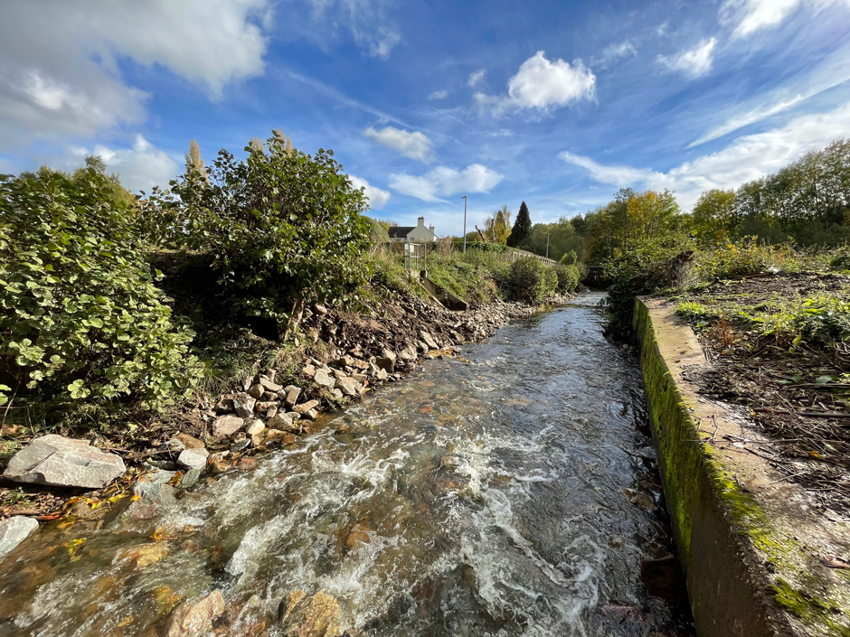 The Ecclesbourne as it falls down boulder ramps towards the location of the old Snake Lane Weir.