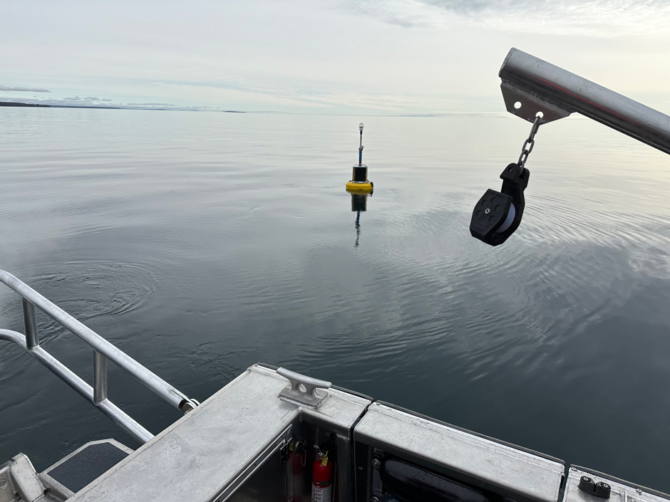 The Keweenaw South Entry buoy (NDBC 45025) after deployment, with Rabbit Island in the background.