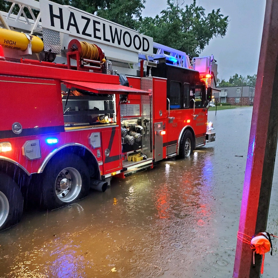 The Hazelwood Fire Department’s ladder truck stands in Coldwater Creek flood waters during the 2022 flood event. At time of photographing, the crew were evacuating residents from their flooded apartments.