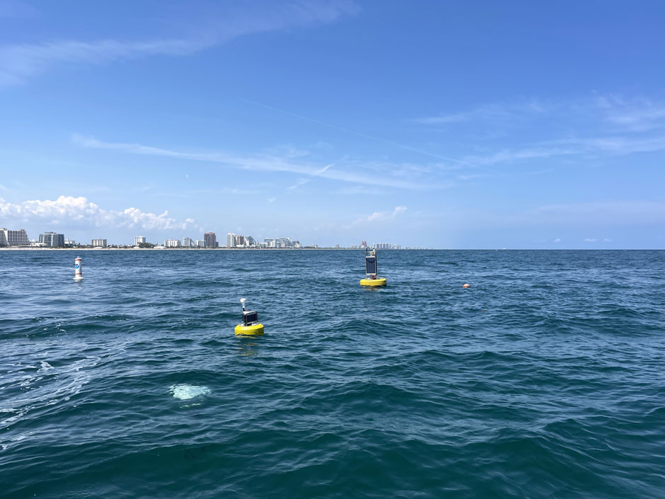 A CB-950 and CB-25 deployed on site at Port Everglades. The sensor buoys are protected by white buoys on the sides to prevent collisions with boats in the area.
