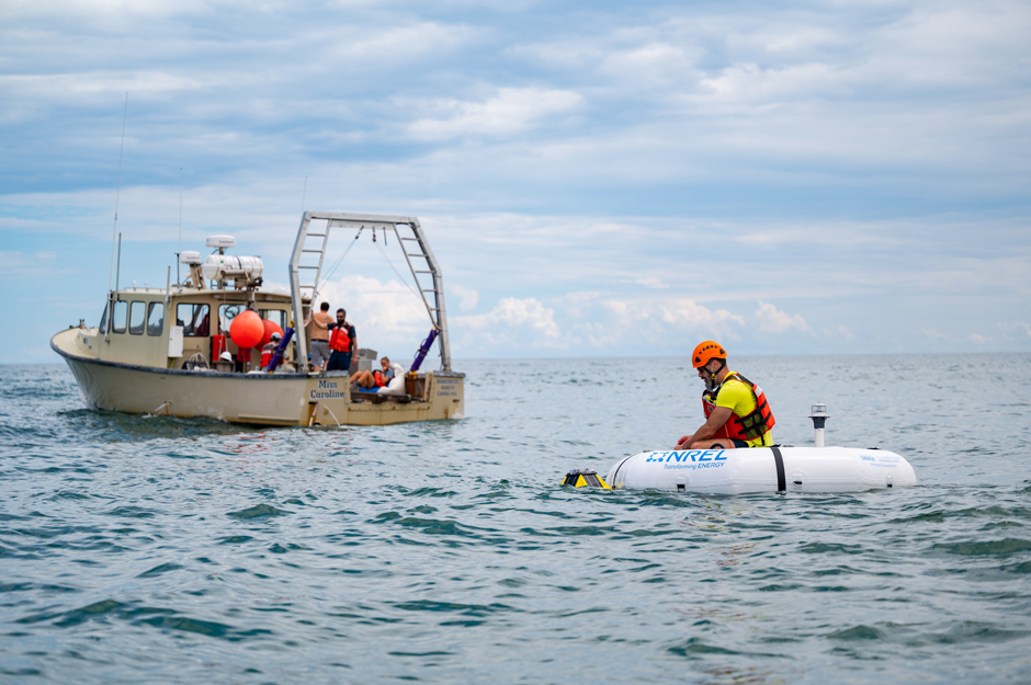 Scott Jenne from the National Renewable Energy Labs (NREL) enabling the HERO WEC at the Jennette’s Pier Wave Energy Test Site. This small buoy system will collect measurements of Gulf Stream dynamics over time.