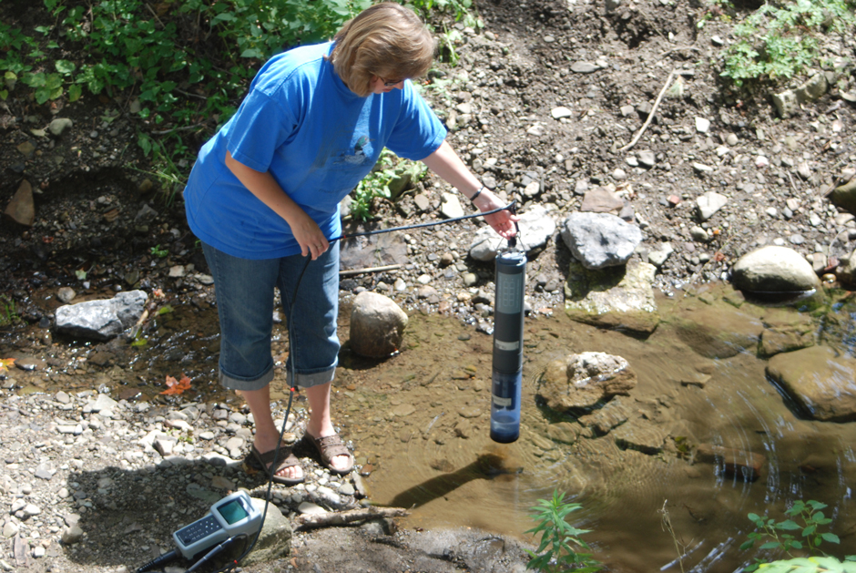 Janis Bowman using a YSI multi-parameter sonde for requested projects in both the lake and selected lake inflows.