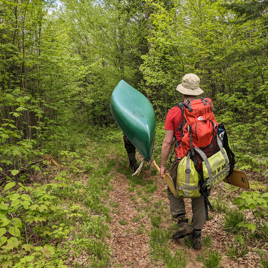 Portage in action. Cray and her team hike into a remote lake ready for another day of fieldwork.