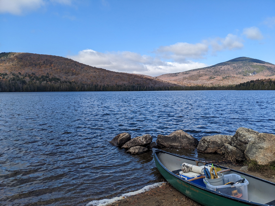 Bald Hill Pond, Westmore, with the equipment-laden canoe in the foreground.