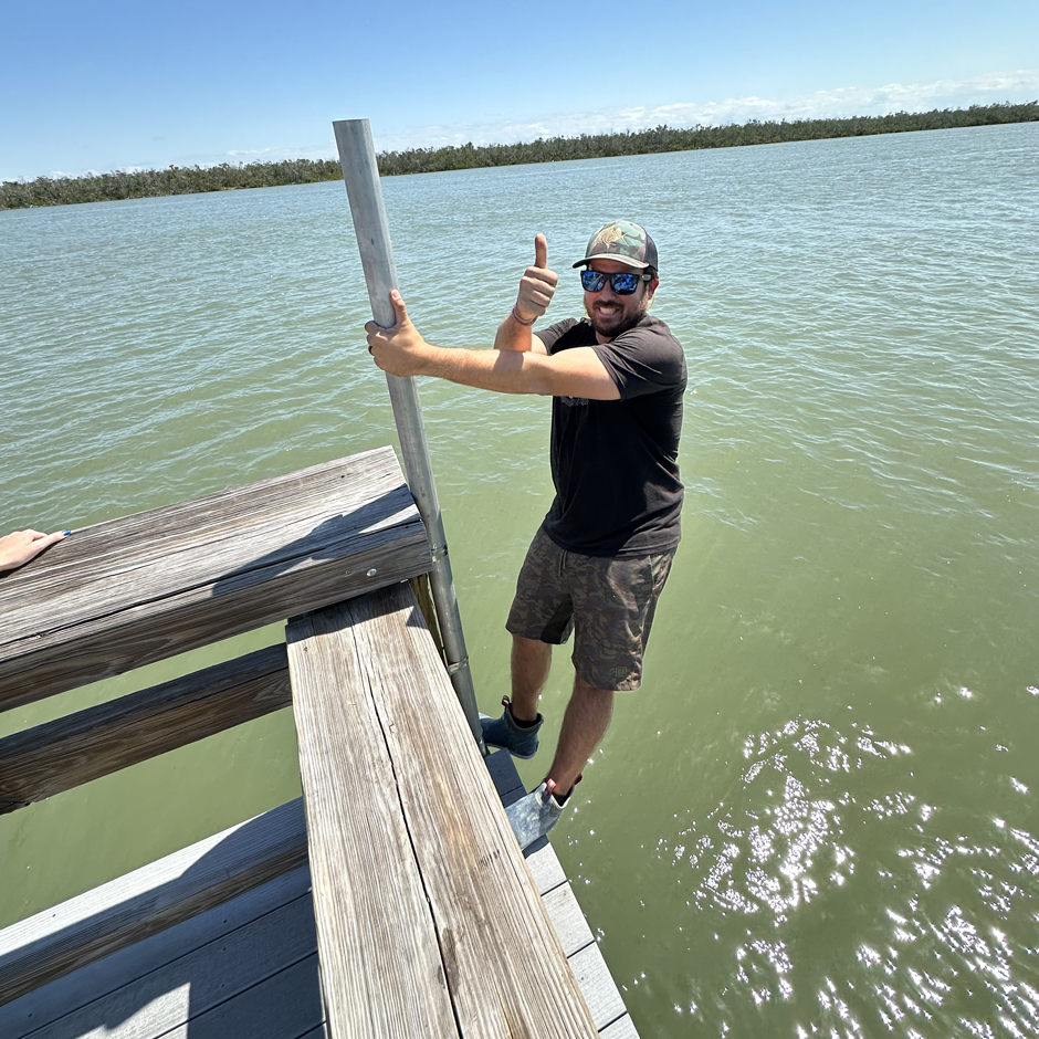 The “mounting strength test.” Catasus uses his body weight to test the strength of deployment materials to ensure systems can remain operational in all conditions, including through hurricanes during the installation of the Mound House site, the newest real-time measurement station.