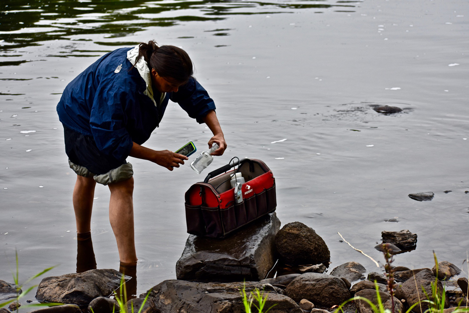 Jan Paul, Penobscot Nation citizen, scanning a QR code on a sample bottle making digital data entry on the cell phone even faster.