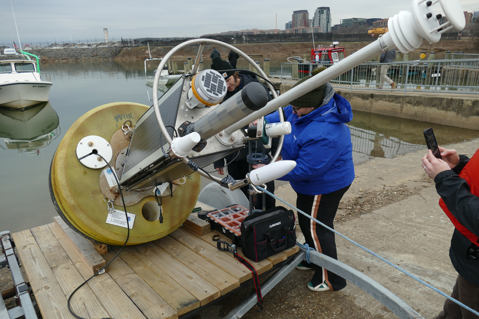 The team prepares to deploy the CURBY. Responding quickly, the team built out, tested and deployed the buoy within days.