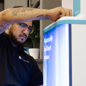 Technician installing the FloWater Refill Station.
