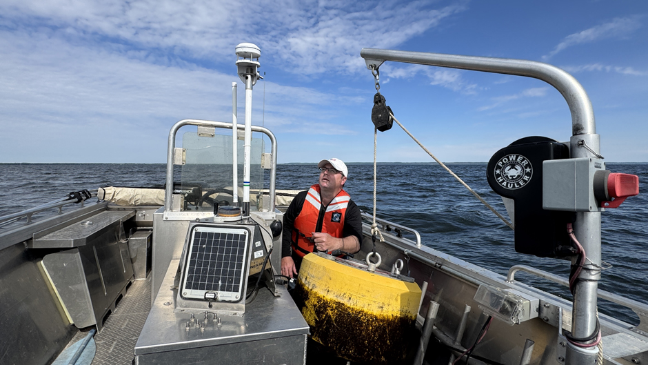 Todd Miller preparing to assemble a Panther Buoy for deployment in Lake Winnebago near Neenah, Wisconsin.