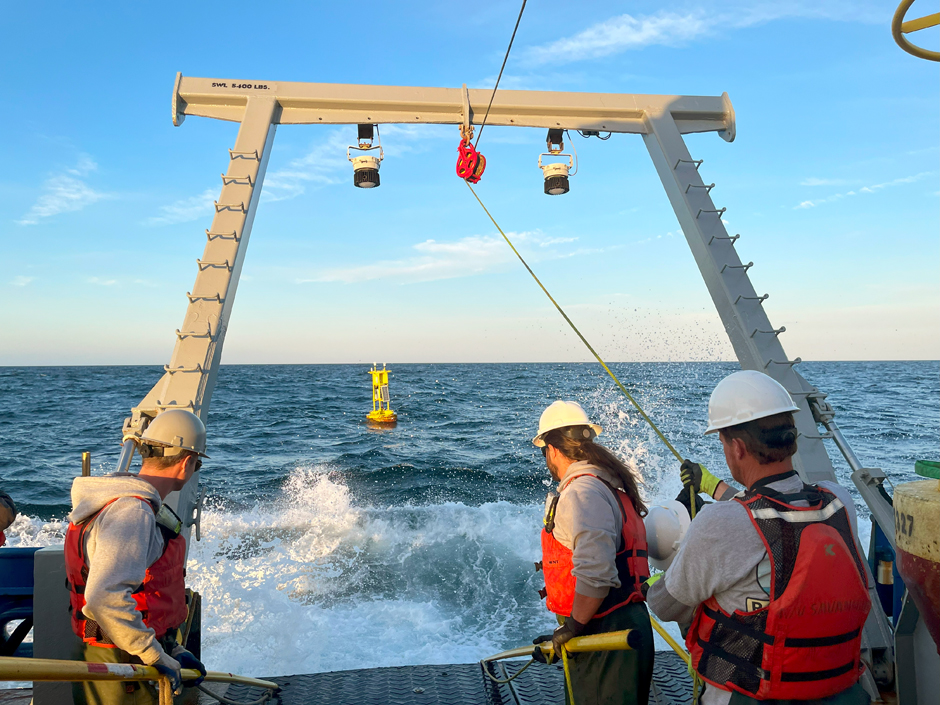 CORMP technician Doug Faircloth prepares to hook into a MET/OCE buoy for recovery onboard the RV Savannah.