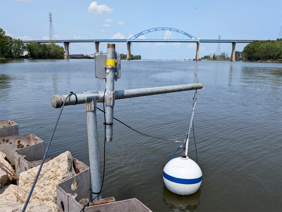 Deployed monitoring buoy housing multi-parameter sonde overlooked by camera to detect harmful algal blooms forming in the Fox River in Green Bay, WI.
