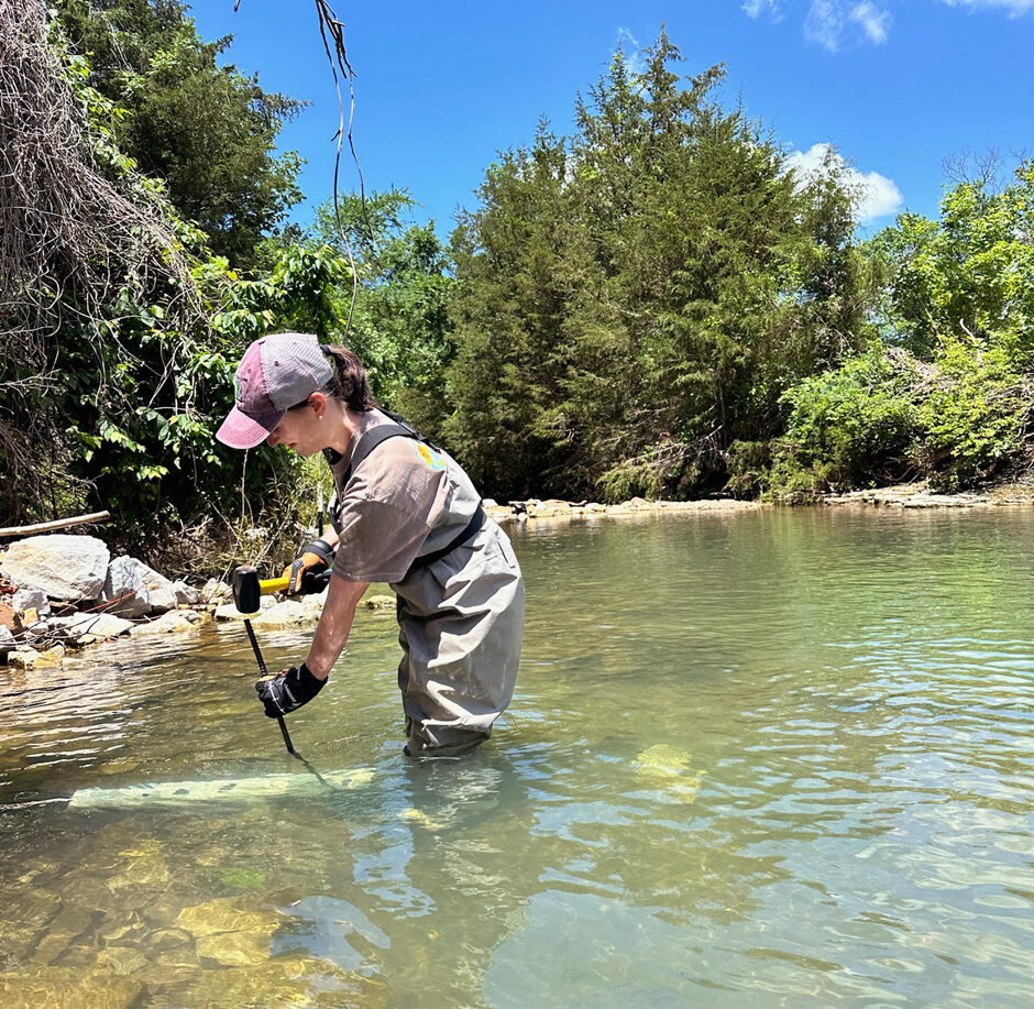 Undergraduate Auldyn Faulk ensures one of the Speir Lab’s s::can spectro::lysers is secure and clean during a routine maintenance visit.