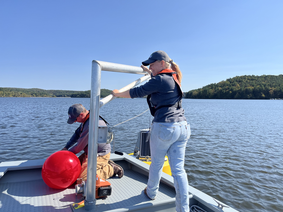 Matt Thomas and Kathryn Hamman using RV Beaver to deploy data buoy TN-01 on Tappan Lake.