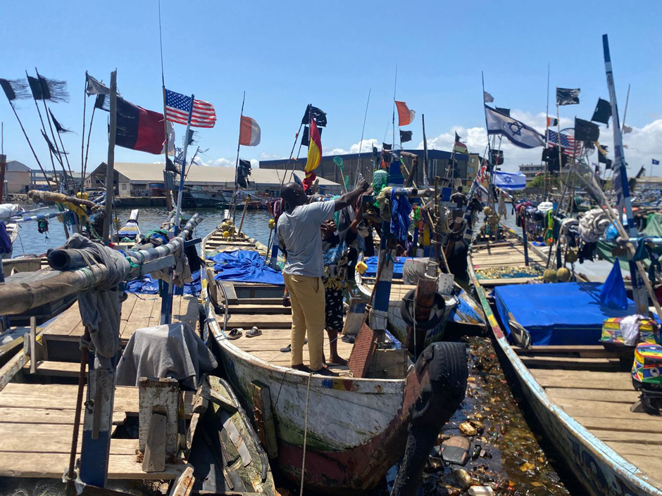 Fishers installing the GPS beacon on their canoes.