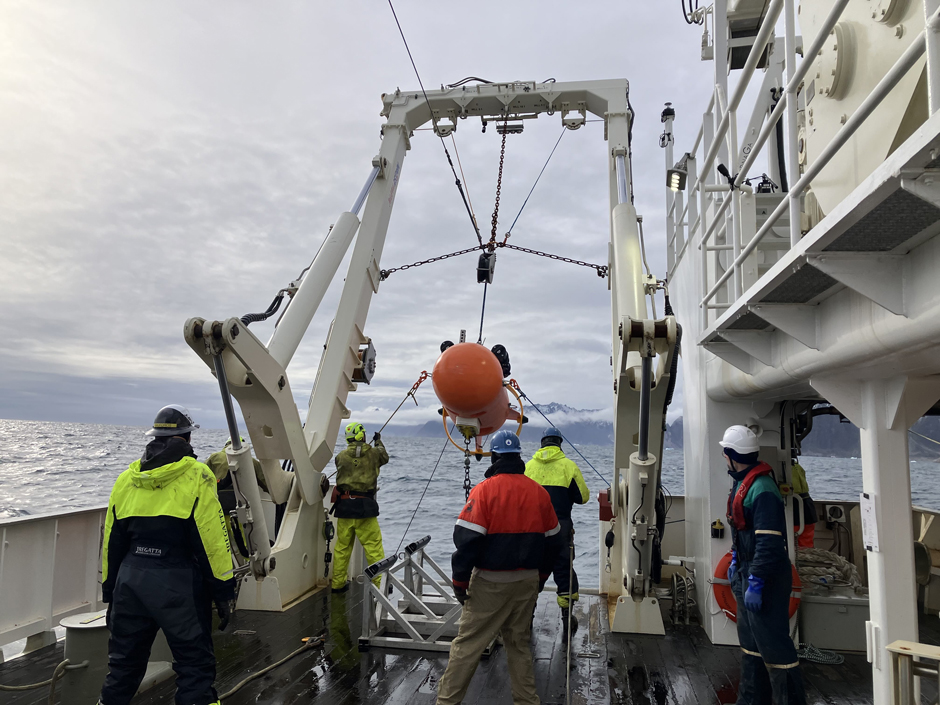 The Stablemoor buoy being deployed by the ship’s crew, and the WHOI Mooring Operations and Engineering group.