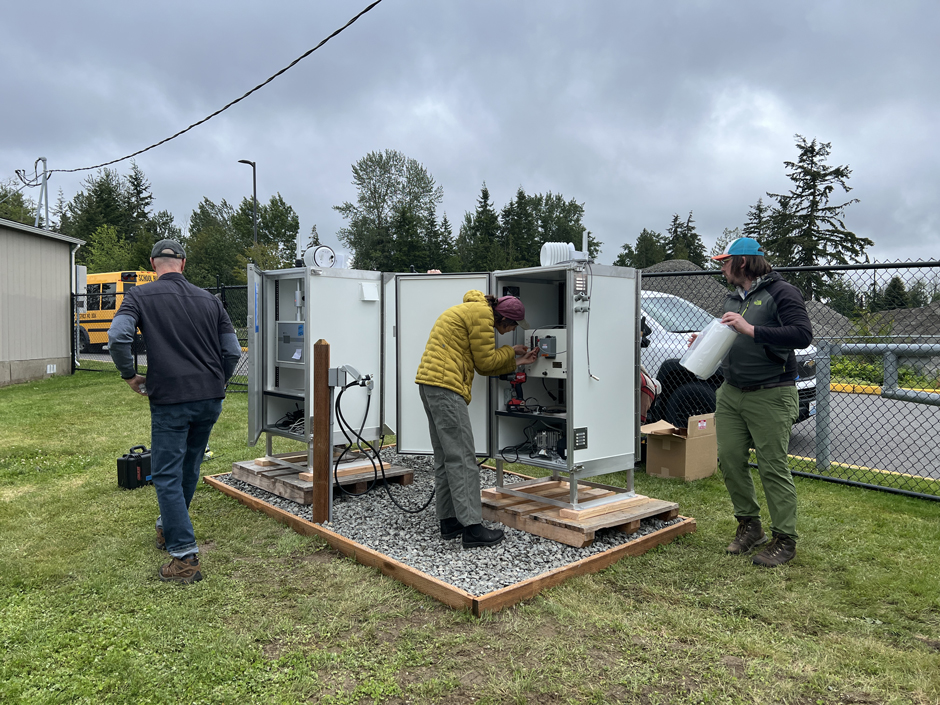 A crew from the Northwest Region Office installing equipment at a monitoring site.